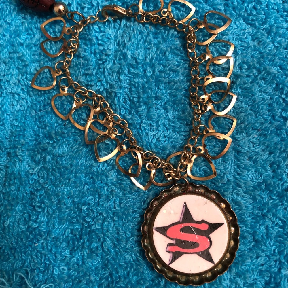 Beautiful vintage bracelet w/ gold hearts Superman